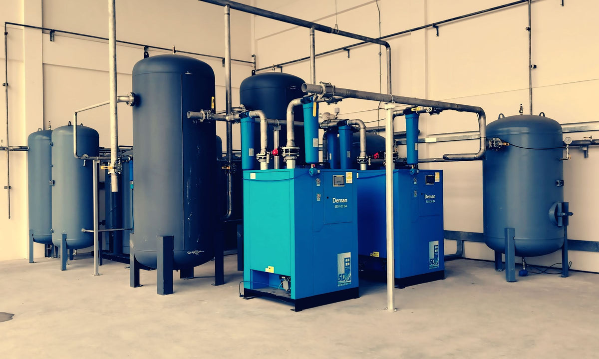 Industrial air compressors and receivers in a plant room