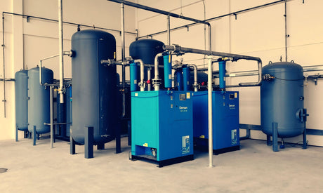 Industrial air compressors and receivers in a plant room