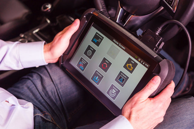 Advanced Diagnostics Smart Pro in use at the steering column