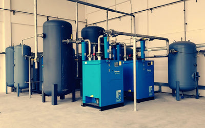 Industrial air compressors and receivers in a plant room