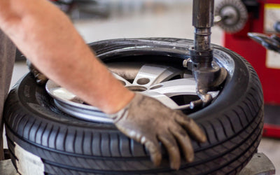 Tyre being changed on a tyre changing machine